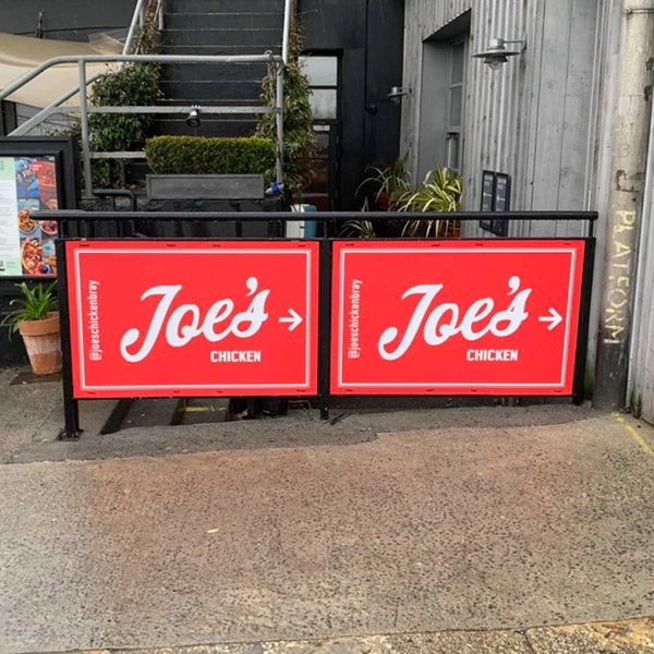 Printed corriboard signs used for outdoor restaurant branding and street level visibility. Lightweight, weather resistant and ideal for temporary outdoor signage, promotions and hospitality displays.