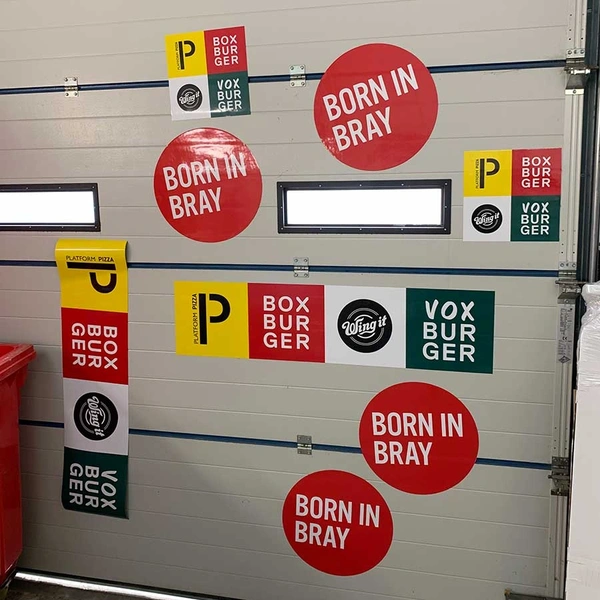 Die-cut circular and rectangular magnetic vehicle signs for Born In Bray, Platform Pizza, Box Burger, Wing It, and Vox Burger. Shows multiple shapes and sizes printed on laminated magnetic material