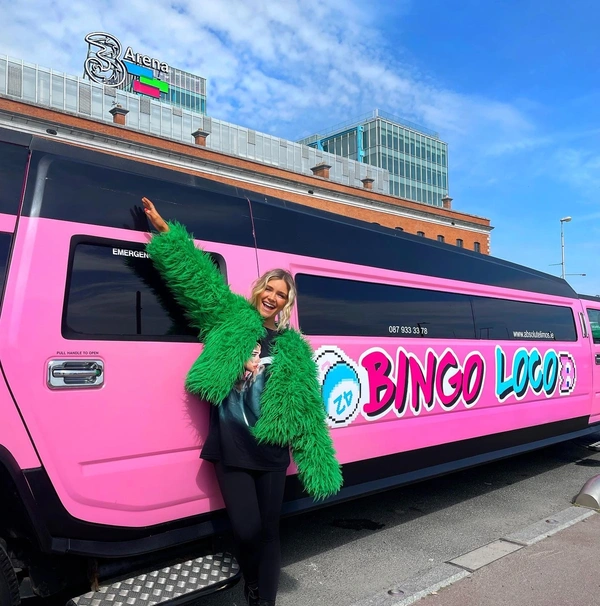  Large magnetic sign on a pink Hummer limousine for Bingo Loco outside the 3Arena in Dublin. Temporary event branding applied for a weekend promotion.